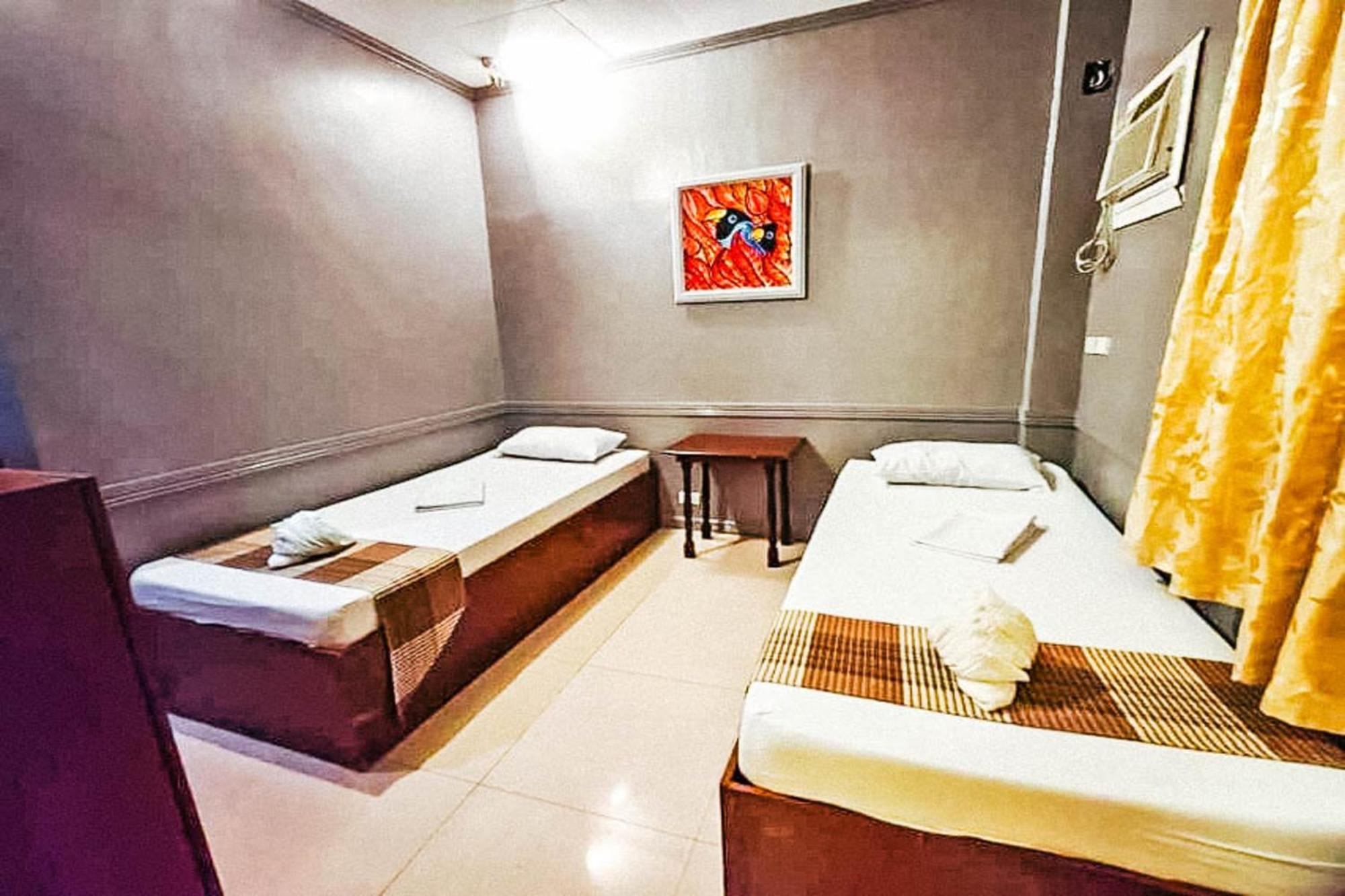 Mbg Travellers Inn Powered By Cocotel Puerto Princesa Room photo