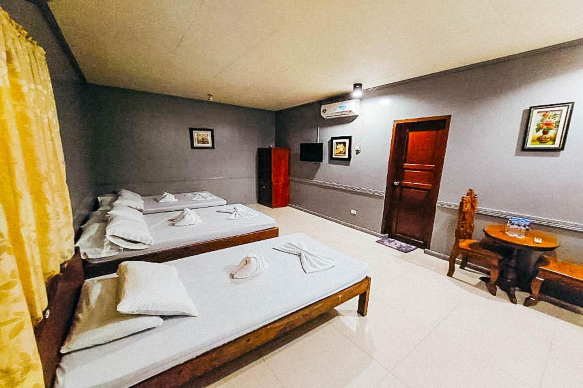 Mbg Travellers Inn Powered By Cocotel Puerto Princesa Room photo