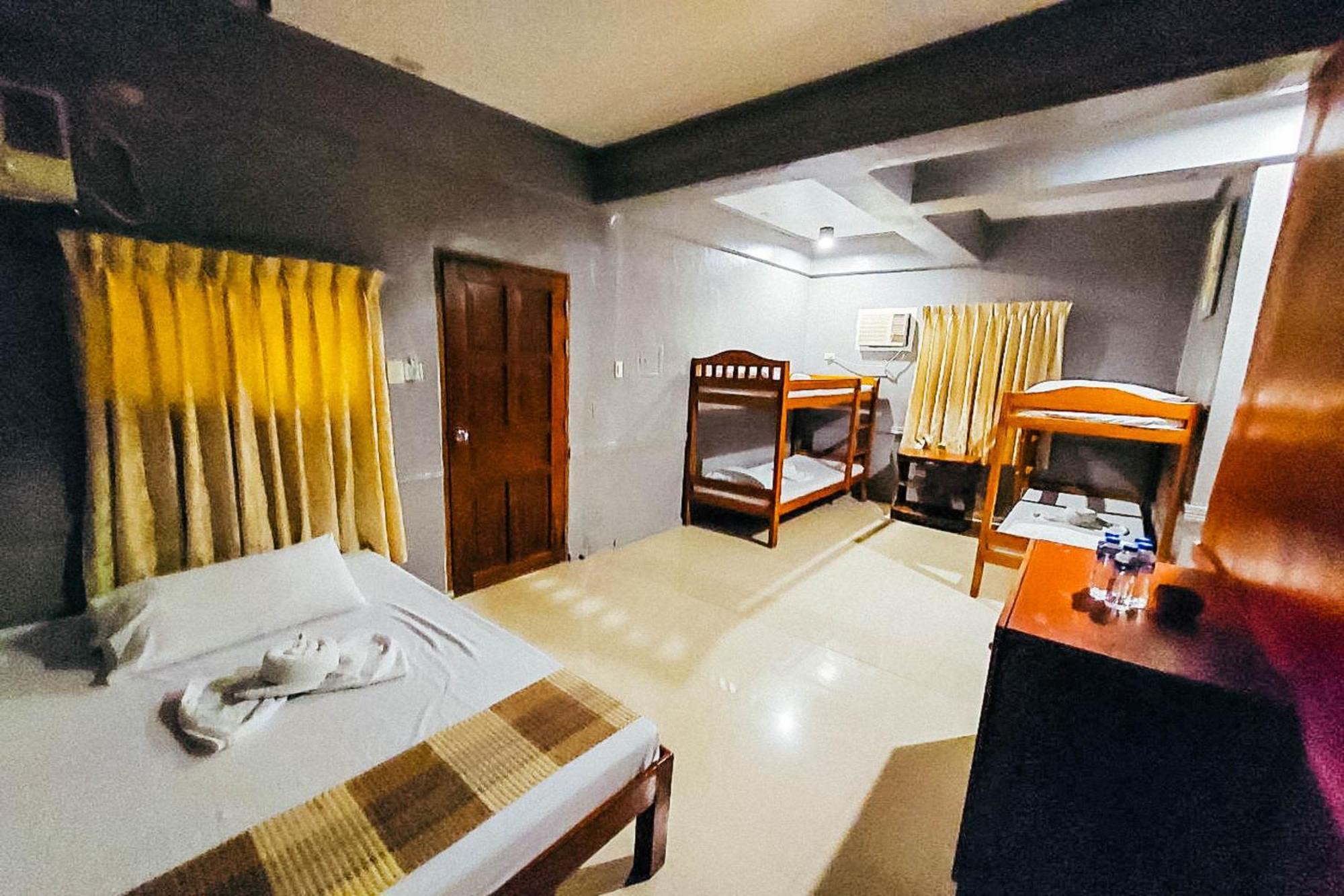 Mbg Travellers Inn Powered By Cocotel Puerto Princesa Room photo