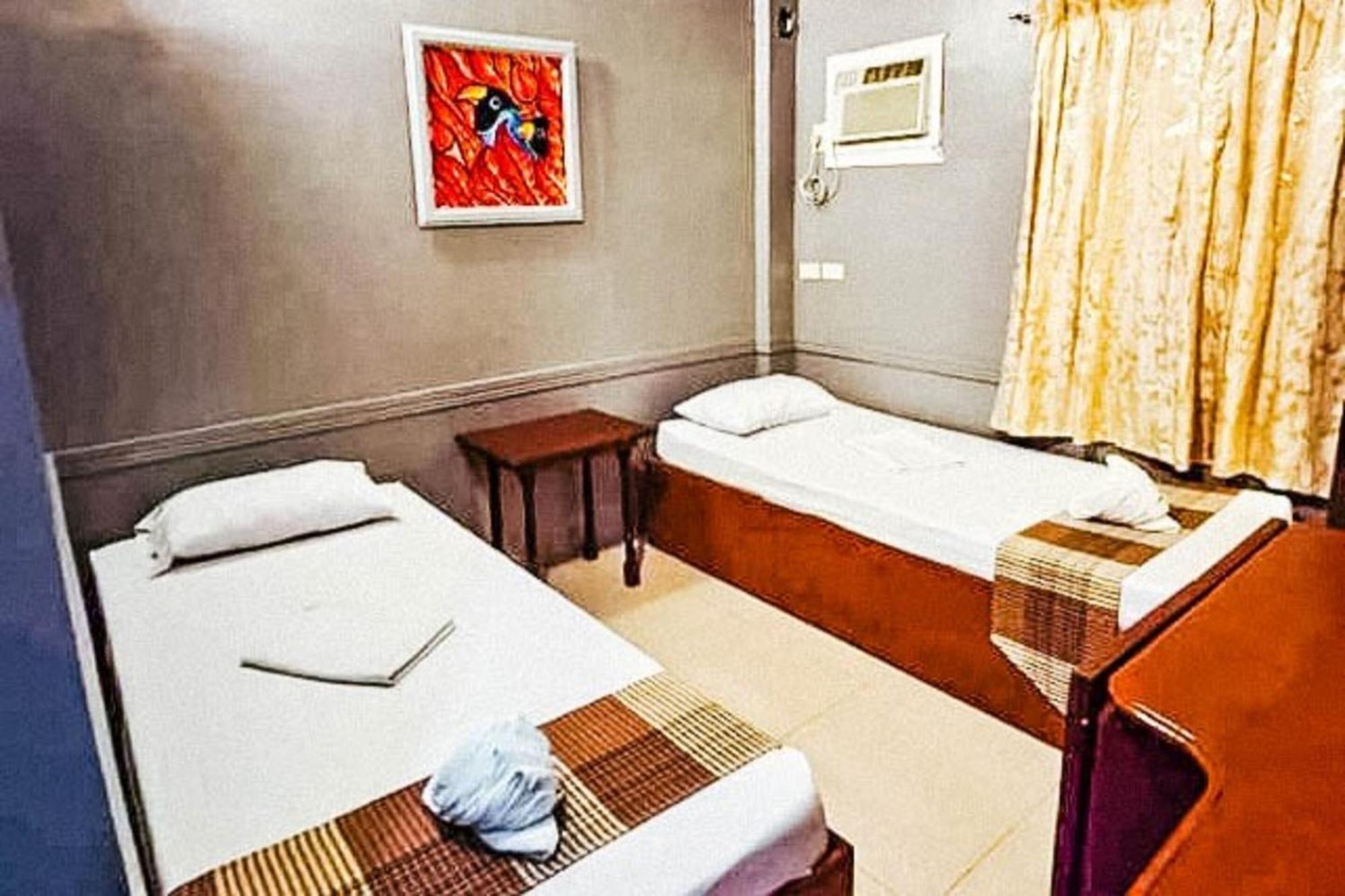 Mbg Travellers Inn Powered By Cocotel Puerto Princesa Room photo