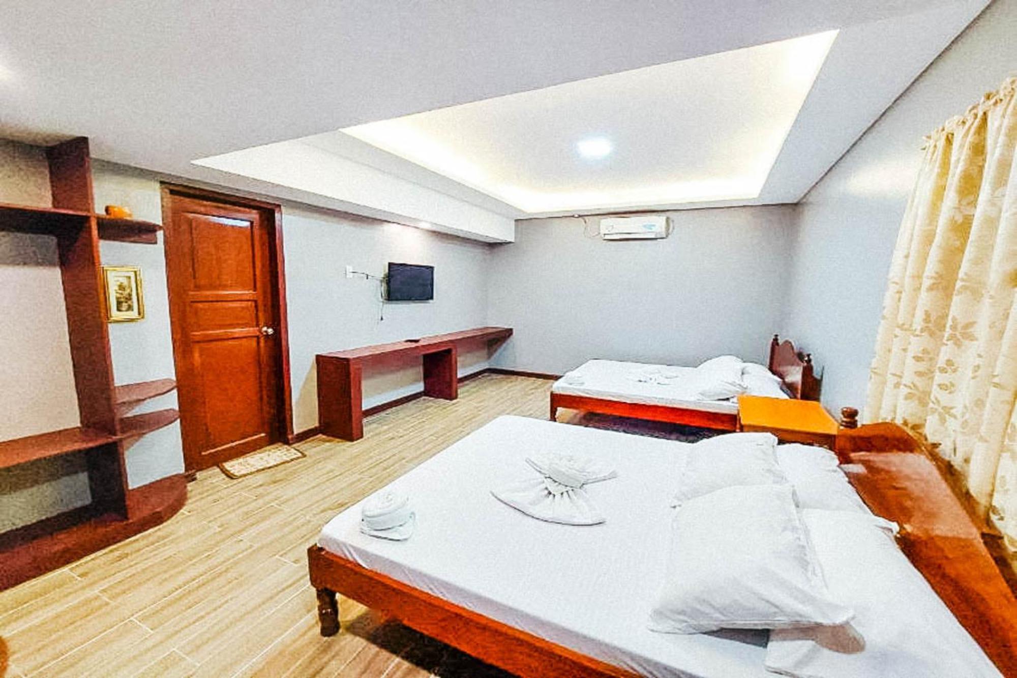 Mbg Travellers Inn Powered By Cocotel Puerto Princesa Room photo