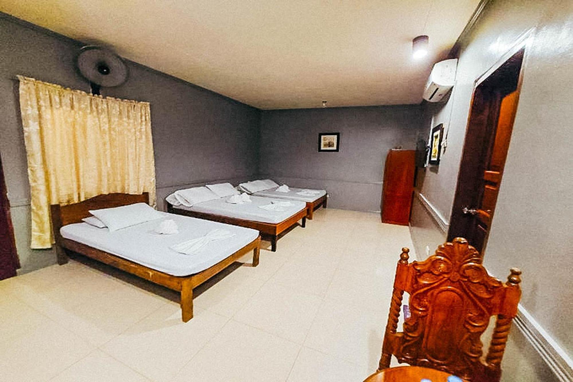 Mbg Travellers Inn Powered By Cocotel Puerto Princesa Room photo