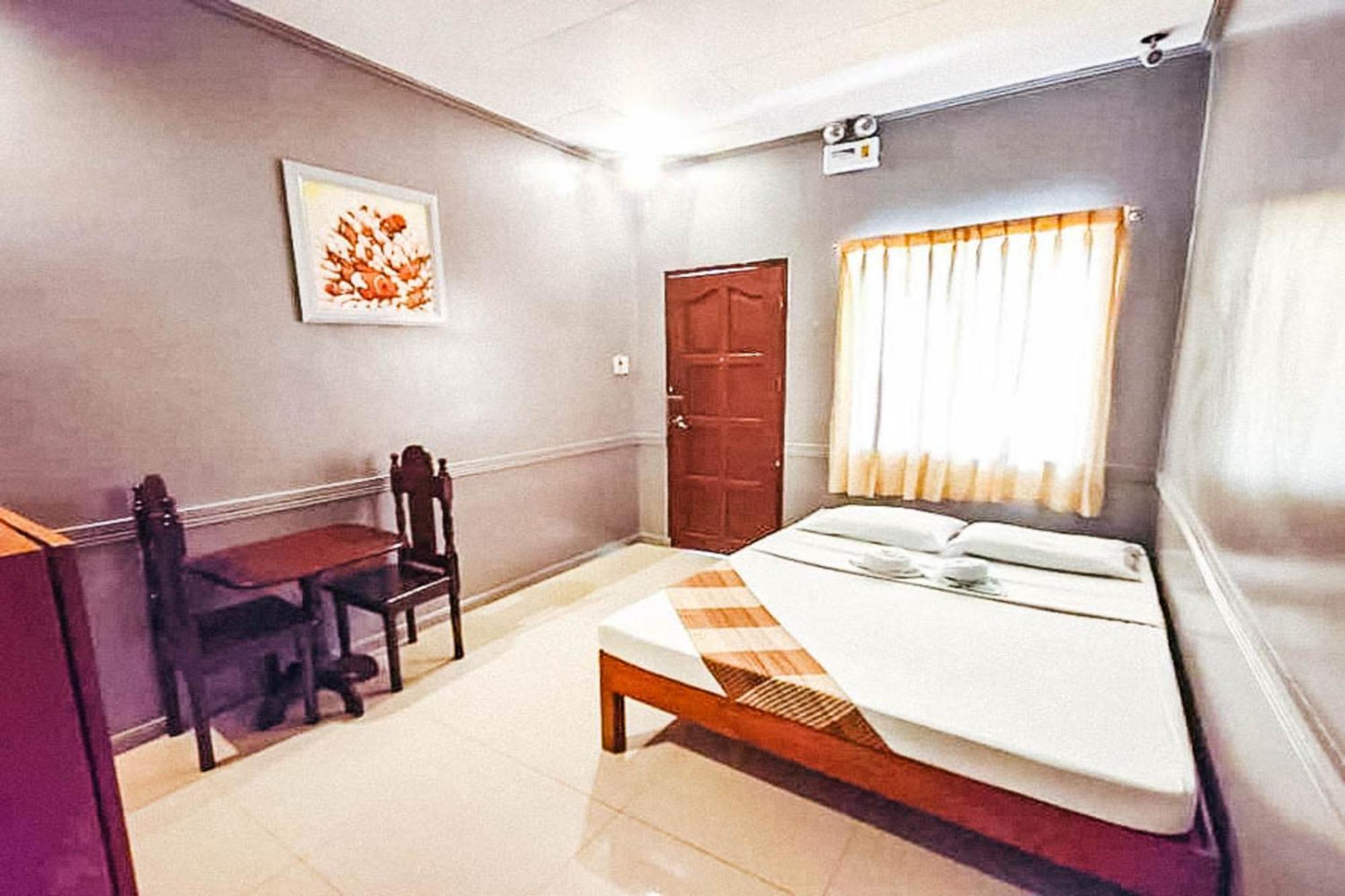 Mbg Travellers Inn Powered By Cocotel Puerto Princesa Room photo