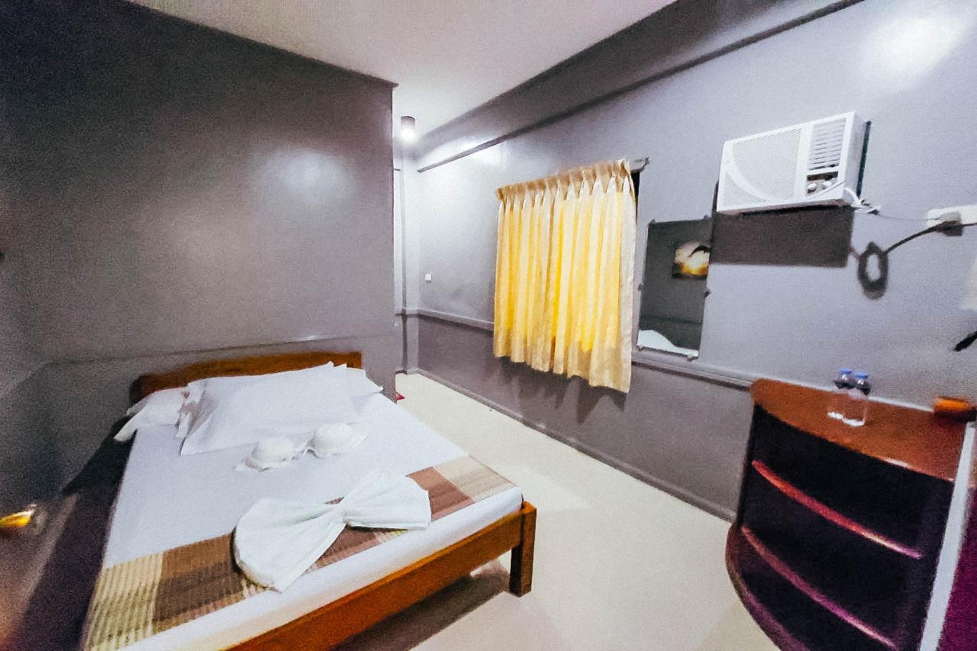 Mbg Travellers Inn Powered By Cocotel Puerto Princesa Room photo
