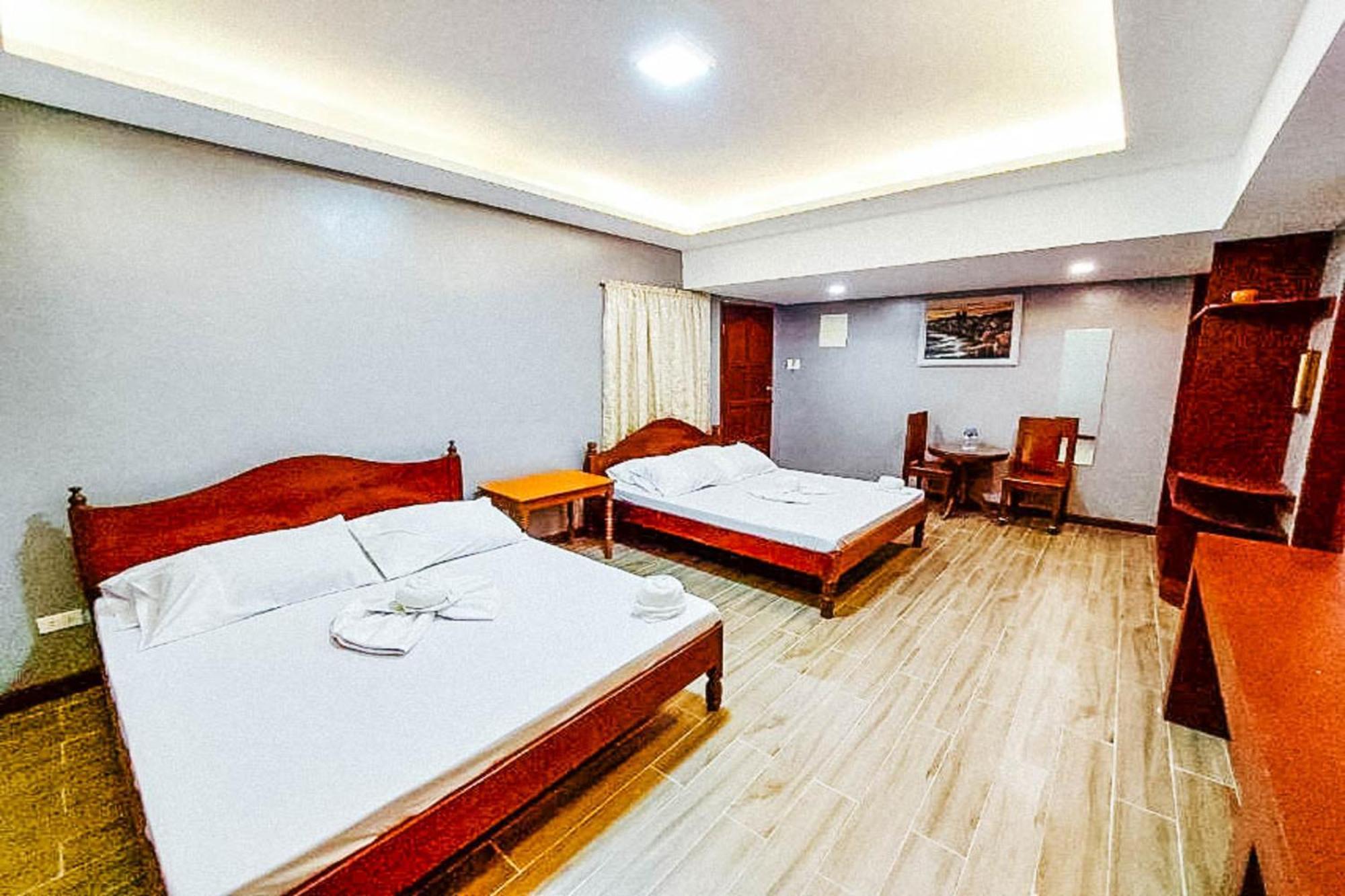 Mbg Travellers Inn Powered By Cocotel Puerto Princesa Room photo