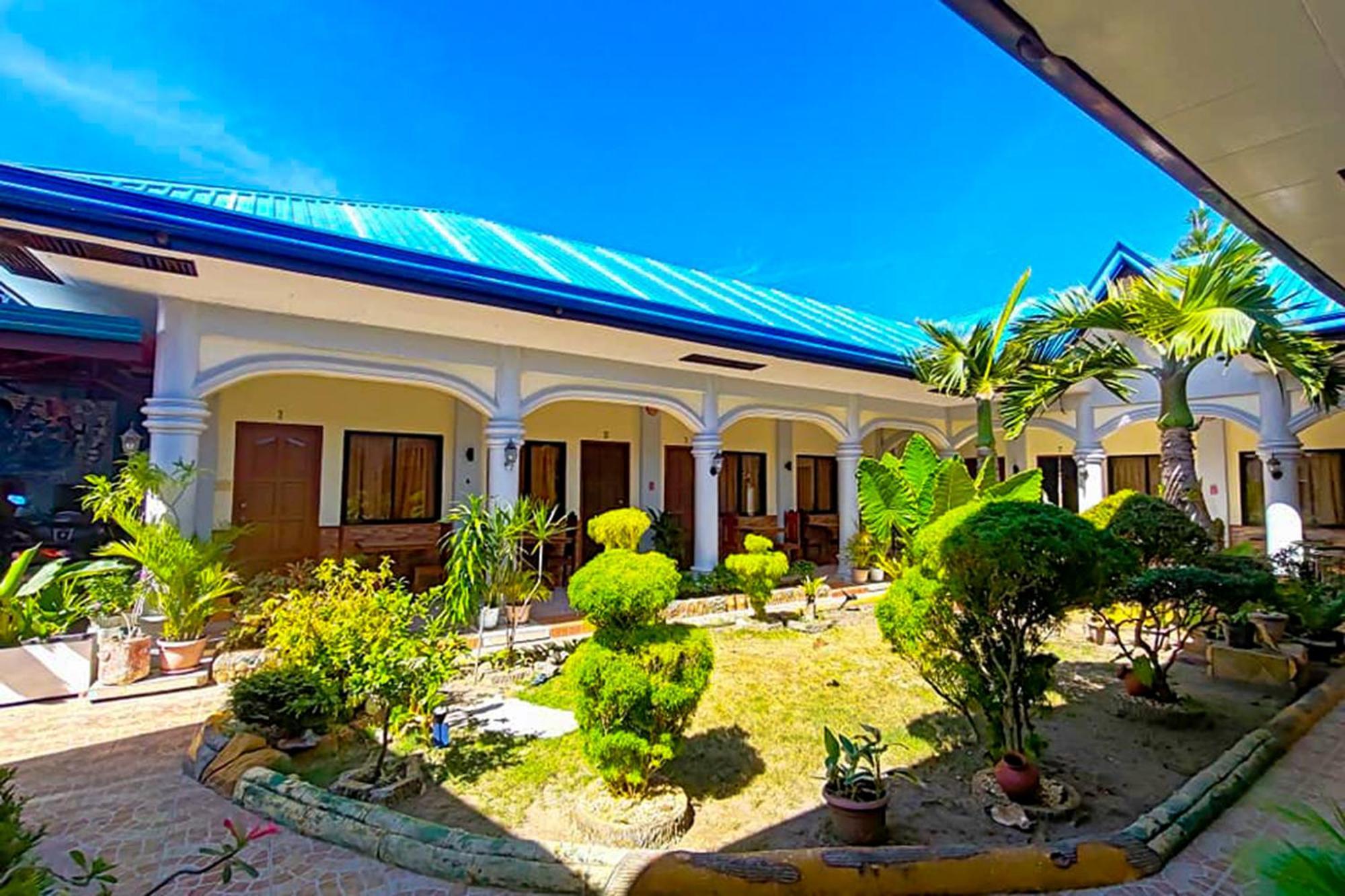 Mbg Travellers Inn Powered By Cocotel Puerto Princesa Exterior photo